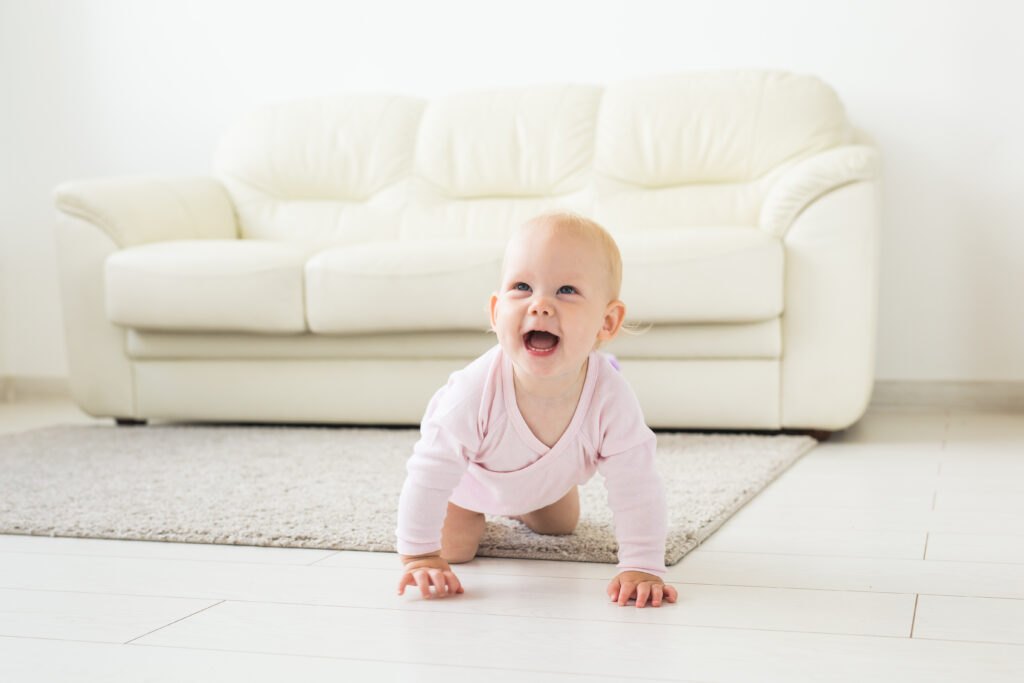 baby on white carpet